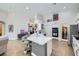Bright, open kitchen with granite countertops, a center island, and stainless steel appliances at 1314 Rossini St, Henderson, NV 89052