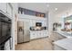 Spacious kitchen with stainless steel appliances, granite countertops, and custom cabinetry at 1314 Rossini St, Henderson, NV 89052