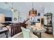 Open-concept living space with modern furnishings, connecting the kitchen and dining areas at 1314 Rossini St, Henderson, NV 89052