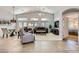 Spacious living room featuring high ceilings, ceiling fan, tile flooring, and comfortable seating at 1314 Rossini St, Henderson, NV 89052