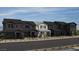 Modern townhomes with unique architectural details and beautiful color schemes are featured at 156 Silver Run Ln, Las Vegas, NV 89138