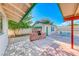 View of a backyard featuring a brick outdoor kitchen and a turquoise dining set at 1721 E Oakey Blvd, Las Vegas, NV 89104