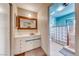 Unique bathroom with a vintage tile vanity, unique glass block shower wall, and colorful walls at 1721 E Oakey Blvd, Las Vegas, NV 89104