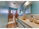 Colorful bathroom with unique tile, a large mirror, and a bathtub shower combo at 1721 E Oakey Blvd, Las Vegas, NV 89104