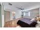 Bright bedroom featuring wood floors, neutral walls, a fan, and natural light at 1721 E Oakey Blvd, Las Vegas, NV 89104