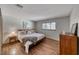 Bright bedroom features wood-look tile flooring, ample natural light, and a ceiling fan at 1721 E Oakey Blvd, Las Vegas, NV 89104