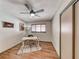 Bright bedroom or office space featuring wood-look tile flooring, a ceiling fan, and a window at 1721 E Oakey Blvd, Las Vegas, NV 89104