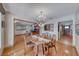 Inviting dining room featuring an elegant chandelier and wood floors that flow into adjacent living spaces at 1721 E Oakey Blvd, Las Vegas, NV 89104