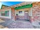 Charming front entrance with brick details, a cozy porch, and classic design elements at 1721 E Oakey Blvd, Las Vegas, NV 89104