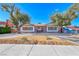 Charming single-story home with mature trees, desert landscaping, brick accents and a covered entrance at 1721 E Oakey Blvd, Las Vegas, NV 89104