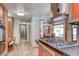 Efficient kitchen connects to dining room with gas cooktop, custom cabinetry, and a layout designed for seamless entertaining at 1721 E Oakey Blvd, Las Vegas, NV 89104