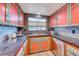 Charming kitchen showcasing custom cabinets, stainless steel appliances, and granite countertops for a modern cooking experience at 1721 E Oakey Blvd, Las Vegas, NV 89104