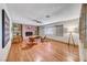 Spacious living room with hardwood floors, a brick fireplace, and built-in shelving at 1721 E Oakey Blvd, Las Vegas, NV 89104