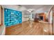 Bright living room includes custom shelving and transitions into the kitchen, providing an open and airy living space at 1721 E Oakey Blvd, Las Vegas, NV 89104