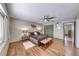 Spacious main bedroom featuring a ceiling fan, wood-look tile flooring, and ample natural light at 1721 E Oakey Blvd, Las Vegas, NV 89104