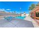 Sparkling pool area with comfortable seating and lush landscaping, perfect for outdoor relaxation at 1721 E Oakey Blvd, Las Vegas, NV 89104