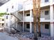 Apartment building with exterior staircase, showcasing a practical and accessible design at 2044 Mesquite Ln # 301, Laughlin, NV 89029