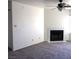 Bright living room featuring a classic fireplace and ceiling fan, creating a welcoming atmosphere at 2044 Mesquite Ln # 301, Laughlin, NV 89029