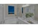 Bathroom with bathtub and city view at night at 2246 Bird Of Prey St, Las Vegas, NV 89138
