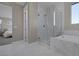 Luxurious bathroom with marble surround, shower and soaking tub at 2246 Bird Of Prey St, Las Vegas, NV 89138