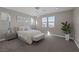 Bright and airy bedroom with neutral decor, ample natural light, and comfortable furnishings at 2246 Bird Of Prey St, Las Vegas, NV 89138