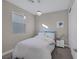 This bedroom features a neutral color palette, modern light fixture, and plush carpeting at 2246 Bird Of Prey St, Las Vegas, NV 89138