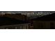 Stunning Las Vegas city view from property featuring a rooftop view and sparkling cityscape in the distance at night at 2246 Bird Of Prey St, Las Vegas, NV 89138