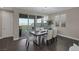Bright dining room with table, chairs, and view of the outdoors through sliding glass doors at 2246 Bird Of Prey St, Las Vegas, NV 89138