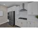 Contemporary kitchen featuring stainless steel appliances, white cabinets, and sleek design at 2246 Bird Of Prey St, Las Vegas, NV 89138