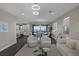 Stylish living area with open floorplan, chic furnishings, and access to dining space at 2246 Bird Of Prey St, Las Vegas, NV 89138