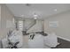 Inviting living room featuring modern decor, staircase, and seamless flow at 2246 Bird Of Prey St, Las Vegas, NV 89138
