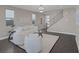 Contemporary living area showcasing modern furnishings, neutral color palette, and staircase access at 2246 Bird Of Prey St, Las Vegas, NV 89138