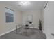 Bright office space with a modern glass desk, neutral décor, and a large window at 2246 Bird Of Prey St, Las Vegas, NV 89138