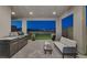 Outdoor living space with pavers, outdoor grill, modern sofa, plants and city views at 2246 Bird Of Prey St, Las Vegas, NV 89138