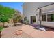 Charming backyard featuring a fire pit and flowering trees at 245 Homesteader Ct, Henderson, NV 89052