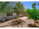 Secluded backyard retreat with mature trees and a cozy patio area at 245 Homesteader Ct, Henderson, NV 89052