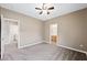 Neutral bedroom with carpeting and multiple doorways at 245 Homesteader Ct, Henderson, NV 89052