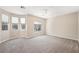 Large bedroom with carpet and natural light from three large windows at 245 Homesteader Ct, Henderson, NV 89052