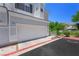 Townhouse with attached garage and well-maintained landscaping at 245 Homesteader Ct, Henderson, NV 89052