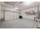 Spacious garage with epoxy flooring, shelving, and storage racks at 245 Homesteader Ct, Henderson, NV 89052