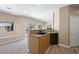 Lovely kitchen with a breakfast bar that opens to the living area and a sliding glass door to the backyard at 245 Homesteader Ct, Henderson, NV 89052