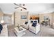 Spacious open concept living room featuring neutral colors, modern decor, and bar seating at 245 Homesteader Ct, Henderson, NV 89052