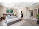 Spacious main bedroom featuring a king bed, closet, and a lovely ensuite bathroom at 245 Homesteader Ct, Henderson, NV 89052