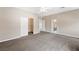 Large main bedroom featuring carpet, a ceiling fan, and access to closet and bathroom at 245 Homesteader Ct, Henderson, NV 89052