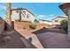 A private backyard featuring low-maintenance landscaping and a concrete patio area at 2455 Silver Blossom Ln, Henderson, NV 89052