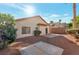 A private backyard featuring low-maintenance landscaping, concrete patio, and privacy fencing at 2455 Silver Blossom Ln, Henderson, NV 89052
