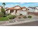 Charming single-story home with a desert rock landscape and a two-car garage at 2455 Silver Blossom Ln, Henderson, NV 89052