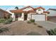 Charming single-story home featuring a desert landscape and a two-car garage at 2455 Silver Blossom Ln, Henderson, NV 89052