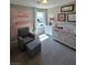 Cozy bedroom with carpet, chair, and crib at 2497 Rofrano Pl, Henderson, NV 89044