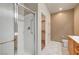 Bathroom featuring a glass-door shower and access to a convenient walk-in closet at 2520 Eclipsing Stars Dr, Henderson, NV 89044